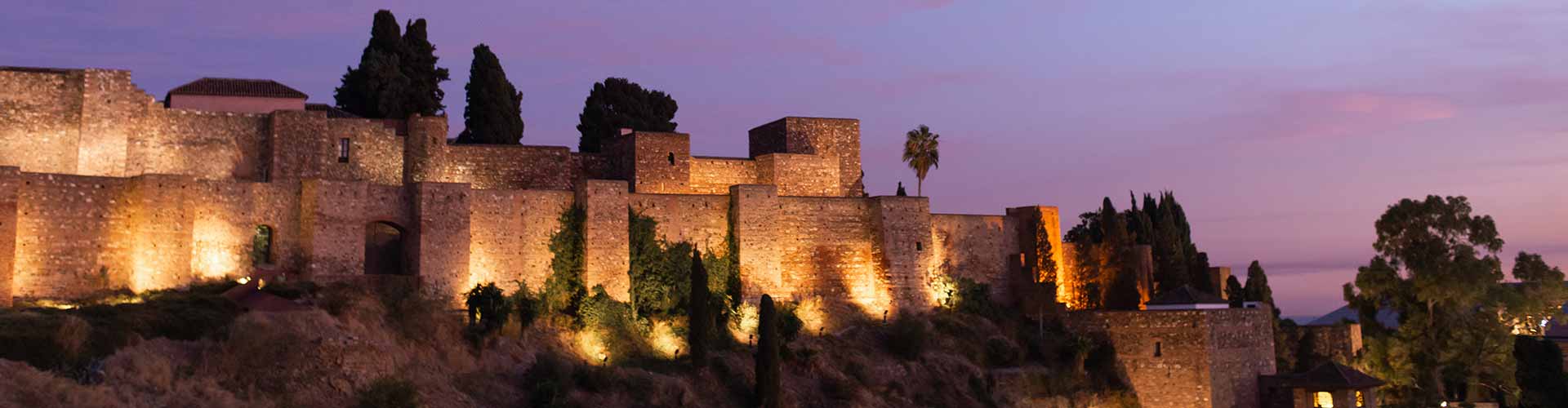 The Castillo de Gibralfaro, a 14th-century castle perched on a hill, offering panoramic views of Malaga